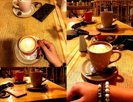 Coffee with milk. A cafe. The young girl.の写真素材