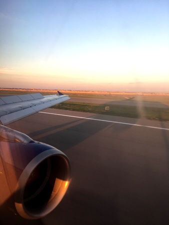 Photo out of the Earth. Takeoff with the shadow of the plane. From a series of unique photos from the airplane window.の写真素材