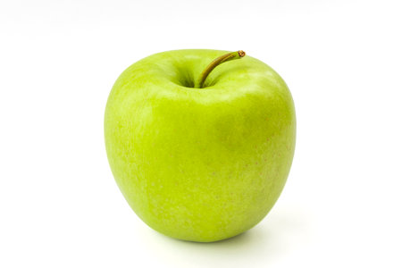 Green apple isolated on white backgroundの写真素材