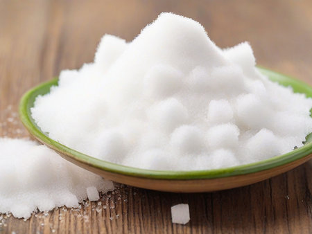Sugar in a bowl on wooden background. Shallow dof.の素材