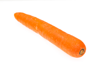 A red carrot on a white backgroundの写真素材