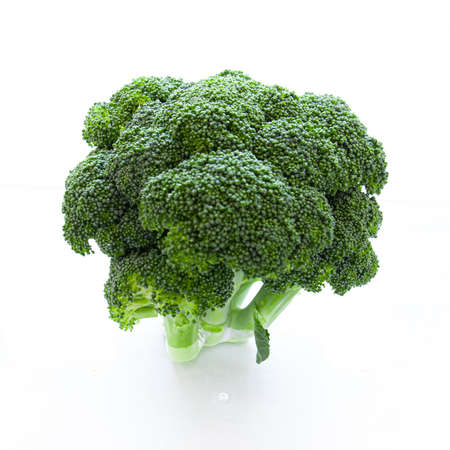 Fresh green vegetables broccoli on white backgroundの写真素材