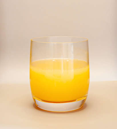 Orange juice in transparent glassの写真素材