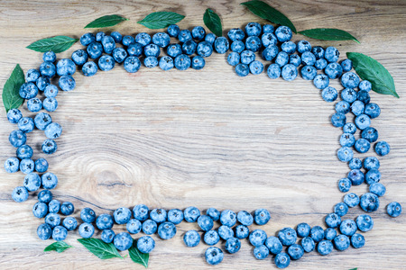 Tasty fresh blueberries heathberry on rustic wood table background. Blueberries are healthy antioxidant organic superfood.の写真素材