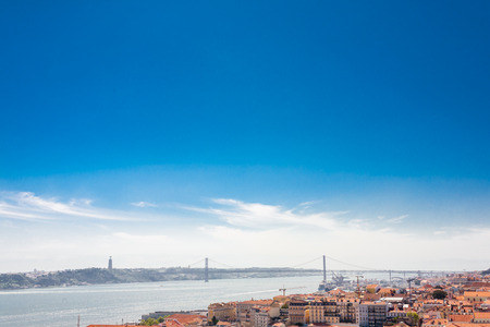 Old Lisbon Portugal street. cityscape with roofs. Tagus river miraduro viewpoint. Spring and summer.