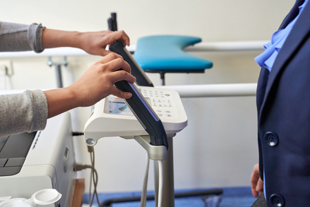 Close up of woman Body Composition Analysis by doctor before Fitness Activity. Woman Checking body with Body Composition Analysis machine. Health care, fitness and weight lossの写真素材