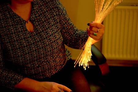 woman in color therapy in the retirement care home. multi sensory stimulating healthcare room spaceの写真素材