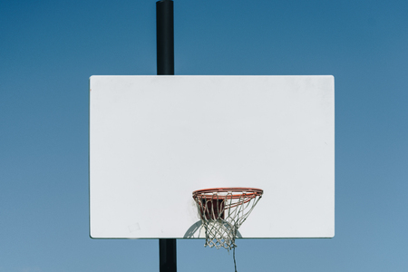 in basketball, the basketball court is the playing surface, consisting of a rectangular floor with baskets at either end.の写真素材