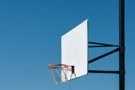 in basketball, the basketball court is the playing surface, consisting of a rectangular floor with baskets at either end.の写真素材