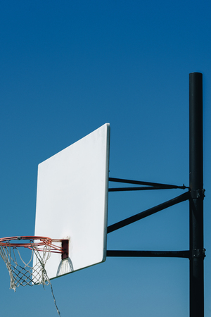 in basketball, the basketball court is the playing surface, consisting of a rectangular floor with baskets at either end.の写真素材
