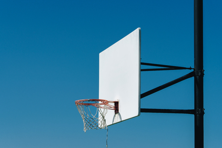 in basketball, the basketball court is the playing surface, consisting of a rectangular floor with baskets at either end.の写真素材