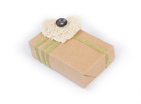 Small parcel wrapped in brown packing paperの写真素材
