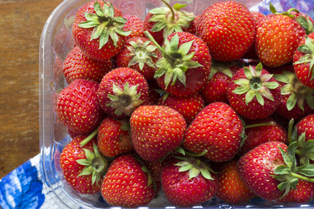 Juicy ripe strawberry on a vintage tableの写真素材