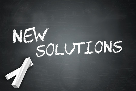 Blackboard with New Solutions wordingの写真素材