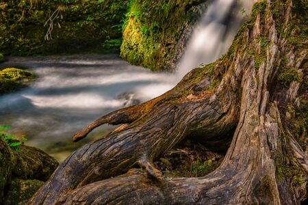 The beautiful Hinanger waterfall, a popular hike in the Allgau near Sonthofenの写真素材