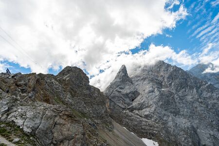 Beautiful hike and climb to the Zugspitze near Ehrwald and Eibsee, the highest mountain in Germanyの写真素材
