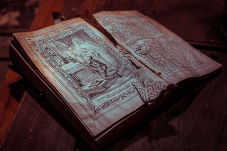 A holy book a bible in an abandoned building with natural decayの写真素材