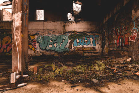 An old abandoned industrial area, with lots of graffiti that is slowly falling apartのeditorial素材