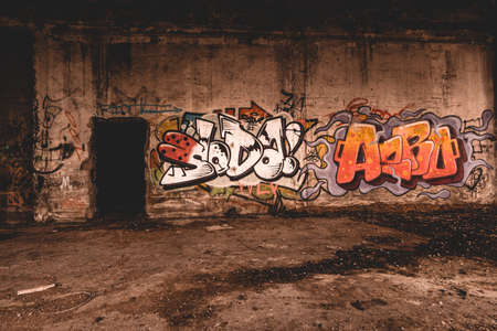 An old abandoned industrial area, with lots of graffiti that is slowly falling apartのeditorial素材