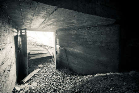 An old abandoned sandstone cellar, a hidden cave in the forest, used for storage in the pastの写真素材