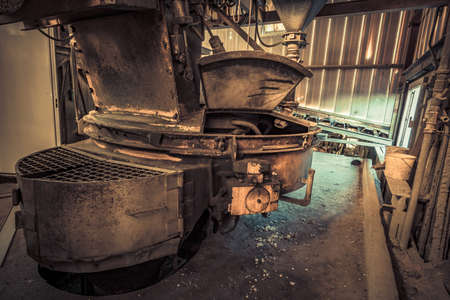 Creepy abandoned industry area with natural decay so-called lost place a decayed factory hallの写真素材