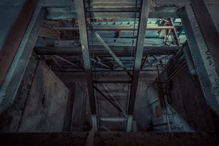 Creepy abandoned industry area with natural decay so-called lost place a decayed factory hallの写真素材