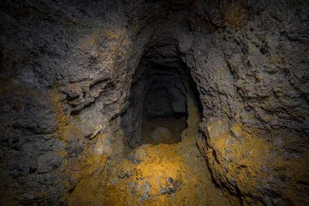 An old abandoned mining facility an ore mine tunnel system undergroundの写真素材