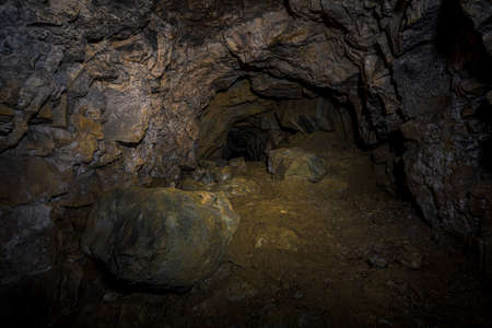 An old abandoned mining facility an ore mine tunnel system undergroundの写真素材