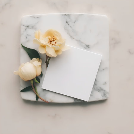 White greeting card with white tulipsle background. Flat lay, top viewの素材