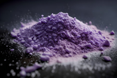Close-up of a purple colored powder on a black background.の素材