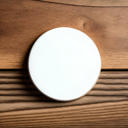 Blank white round box on a wooden background. Mockup.の素材