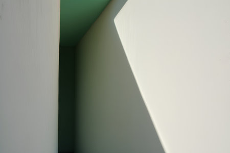 White and green wall with shadow from the window. Abstract background.の素材