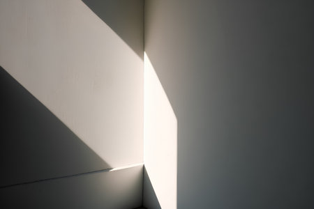 Abstract light and shadow on the white wall. Light from the window.の素材