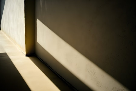 The shadow of the sun on the concrete wall in the room.の素材