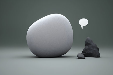 Stone and speech bubble on grey background. 3d rendering. Computer digital drawing.の素材