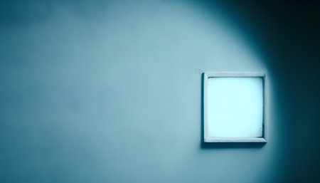 blue wall with white window and light from the window, abstract backgroundの素材