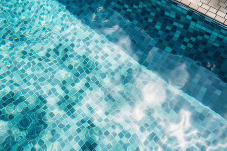 Swimming pool with sun reflections. Abstract background. Top view.の素材