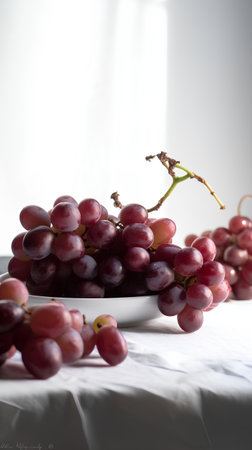 Bunch of red grapes on a white background. Selective focus.の素材