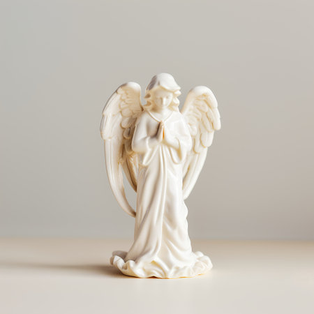 Angel figurine on white background. Minimalistic still life.の素材