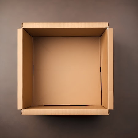Empty cardboard box on a dark background, top view, copy spaceの素材