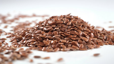Flax seeds on a white background. Selective focus, shallow depth of field.の素材