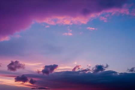Beautiful sunset sky with clouds. Colorful sunset sky with cloudsの素材