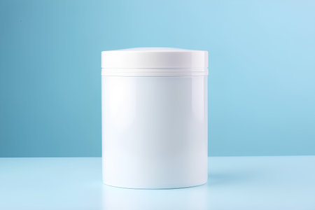 Blank white cosmetic bottle on blue background. Mockup for design.の素材