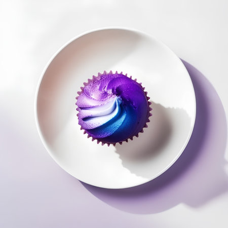Cupcake on a white plate. Minimal food concept.の素材