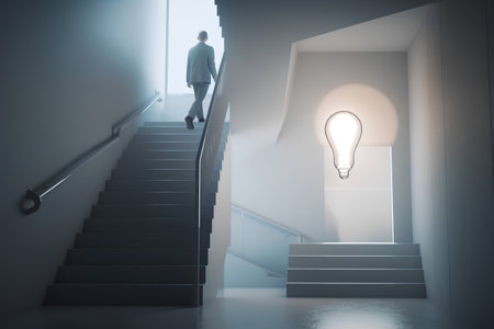 Businessman climbing up the stairs to lightbulb, conceptual imageの素材
