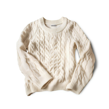 Beige knitted sweater isolated on white background with clipping path.の素材