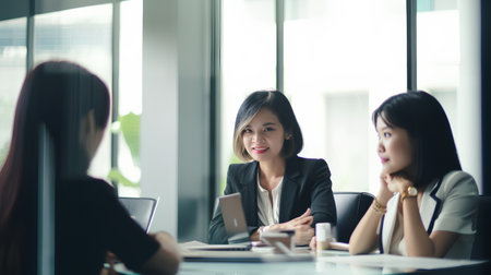 Group of business people discussing the charts and graphs showing the results of their successful teamworkの素材