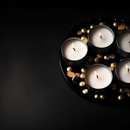Burning candles with golden hearts on a black background. Valentine's Dayの素材