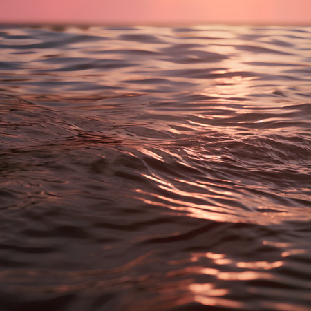 Beautiful sunset in the sea. Close-up of water ripplesの素材