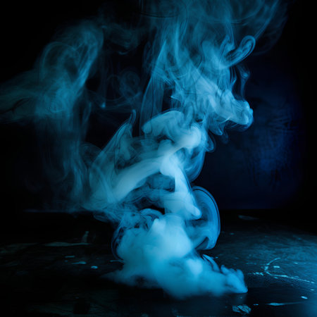 Smoke from a vape on a black background. Toned.の素材